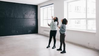 women in a room looking up